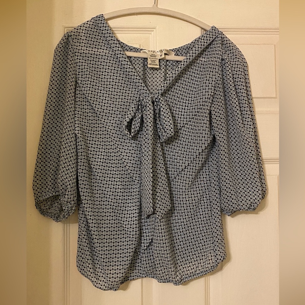 Pale blue top.